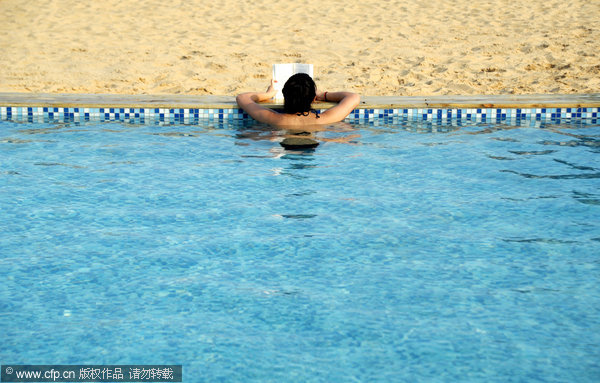 Sand, swimming, and the city skyline on the Bund