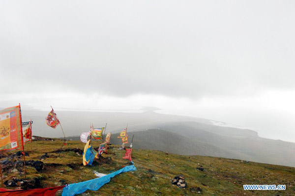 A gleam of clouds covered sister lakes in Qinghai