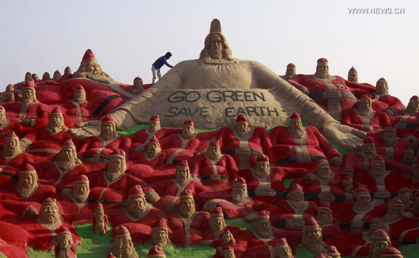 Artists create sand sculptures on beach of Puri, India