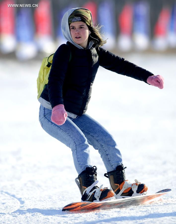 Tourists ski in China's Shenyang