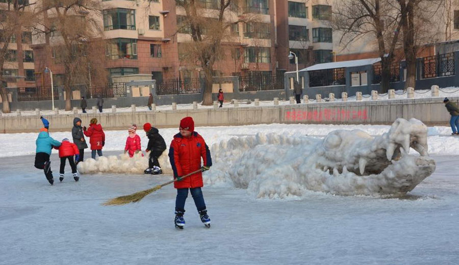 Giant crocodile sculpture made with snow