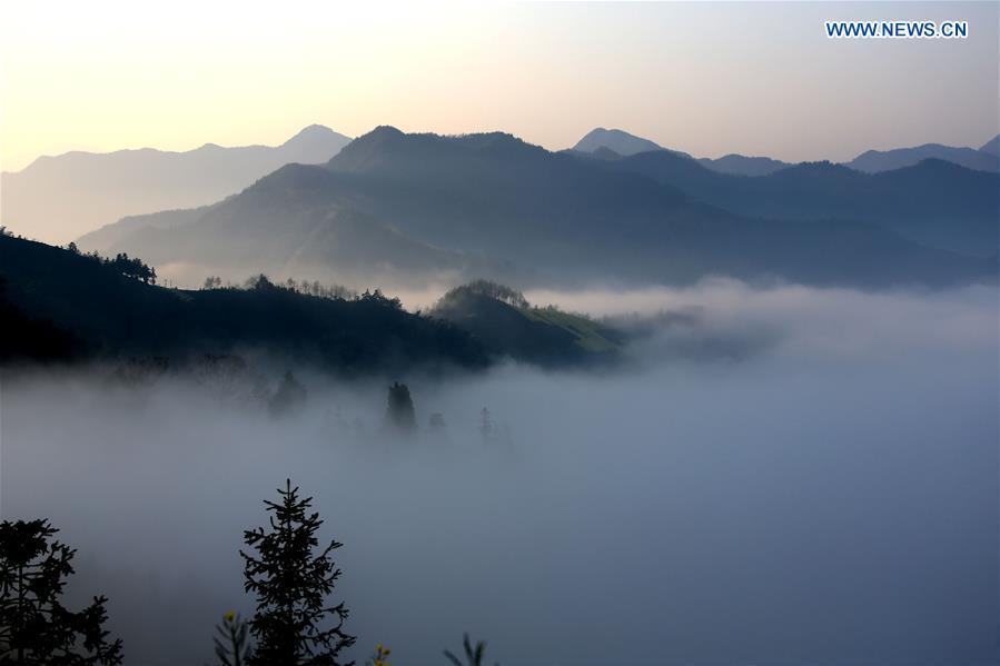 Clouds shroud ancient village Shitan, Anhui