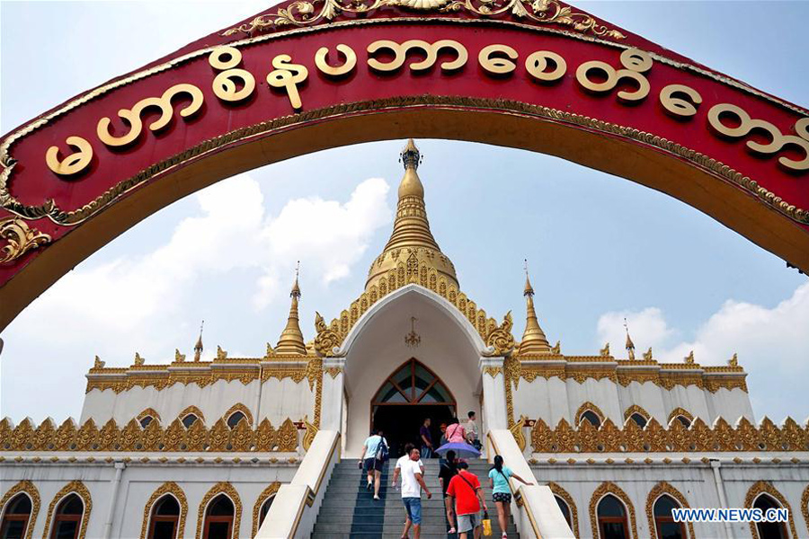 People visit Myanmar style shrine in C China's Henan