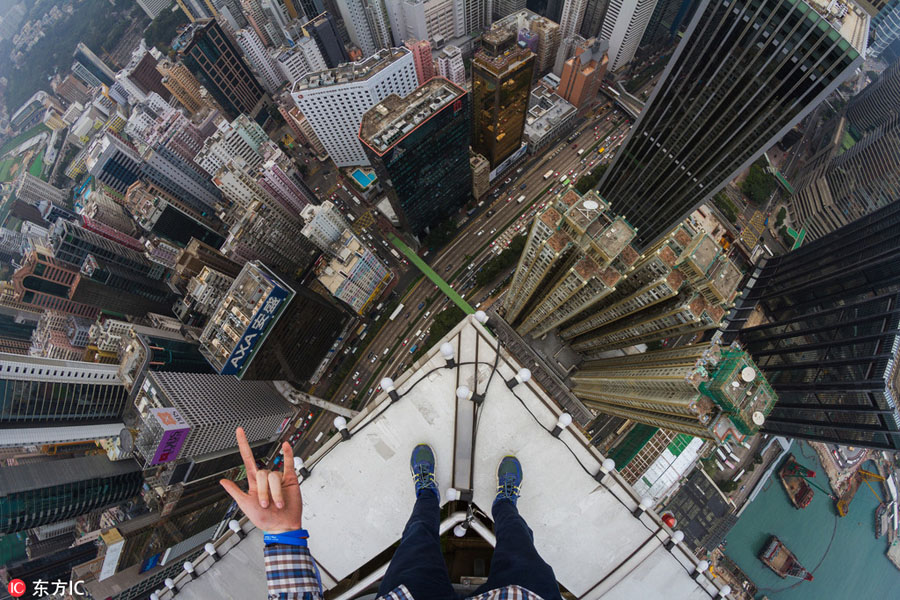 Daredevil thrill-seekers on top of Hong Kong