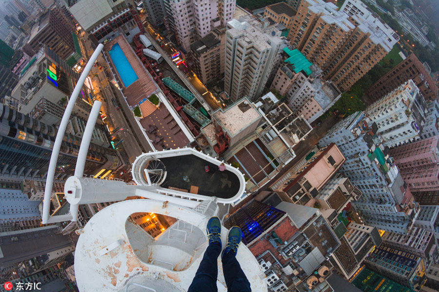 Daredevil thrill-seekers on top of Hong Kong