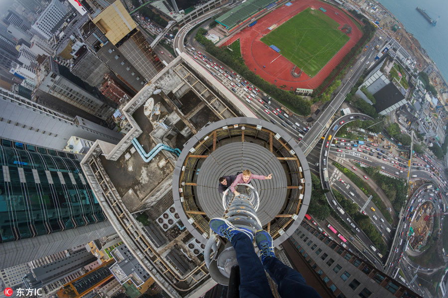 Daredevil thrill-seekers on top of Hong Kong