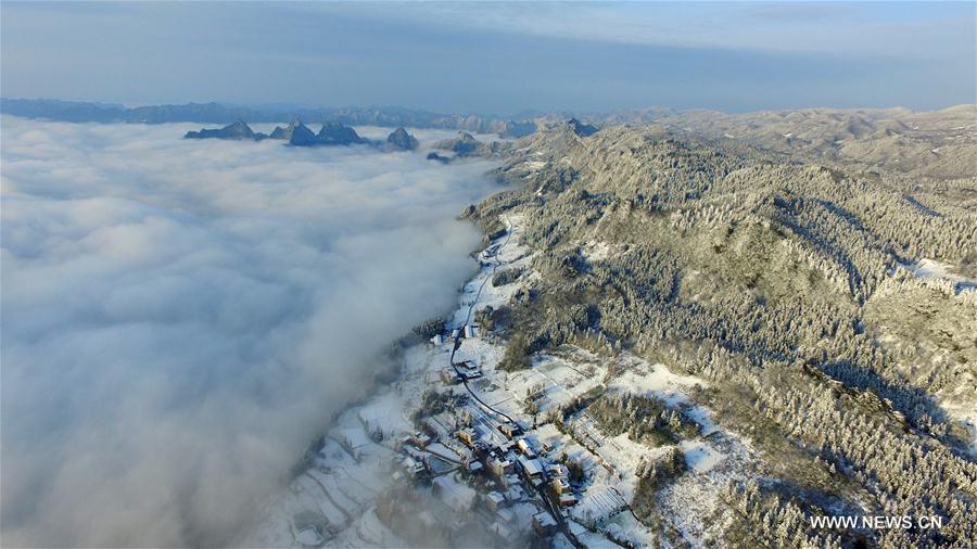Sea of clouds seen over snow-covered mountains in Hubei