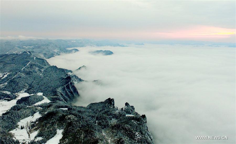 Sea of clouds seen over snow-covered mountains in Hubei