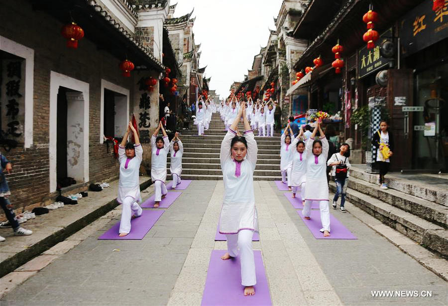 Fans practice yoga in Guizhou province