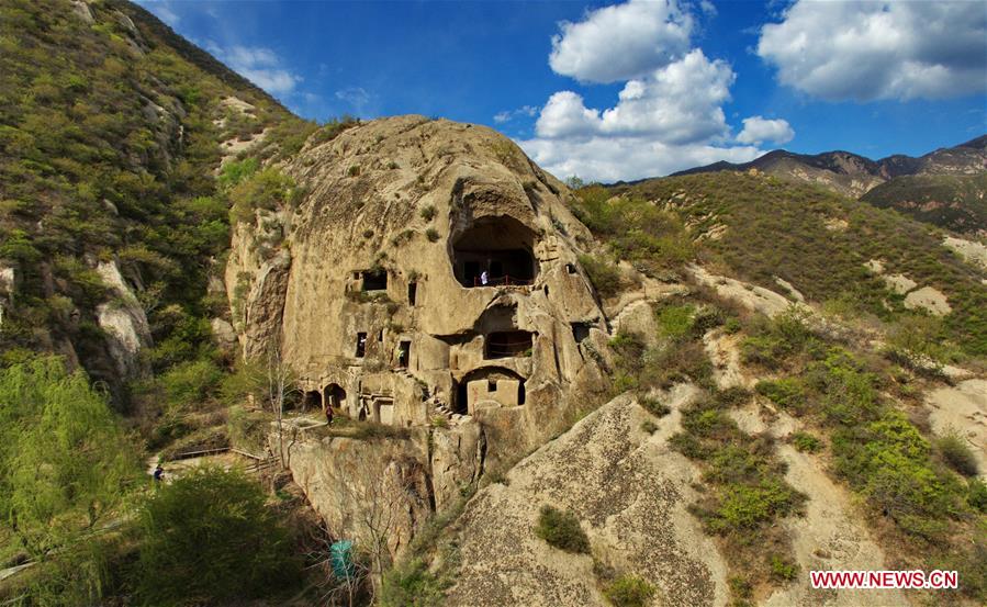 Tourists visit rock cave of Northern Wei Dynasty in N China's Hebei