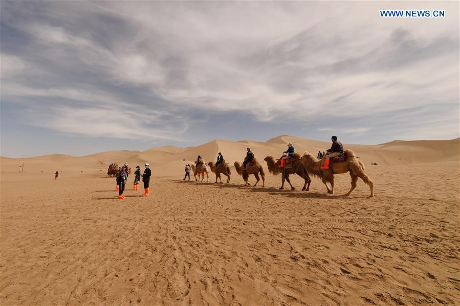 Mingsha Sand Mountain scenery zone in Dunhuang attracts tourists