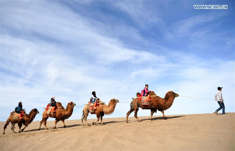 Mingsha Sand Mountain scenery zone in Dunhuang attracts tourists