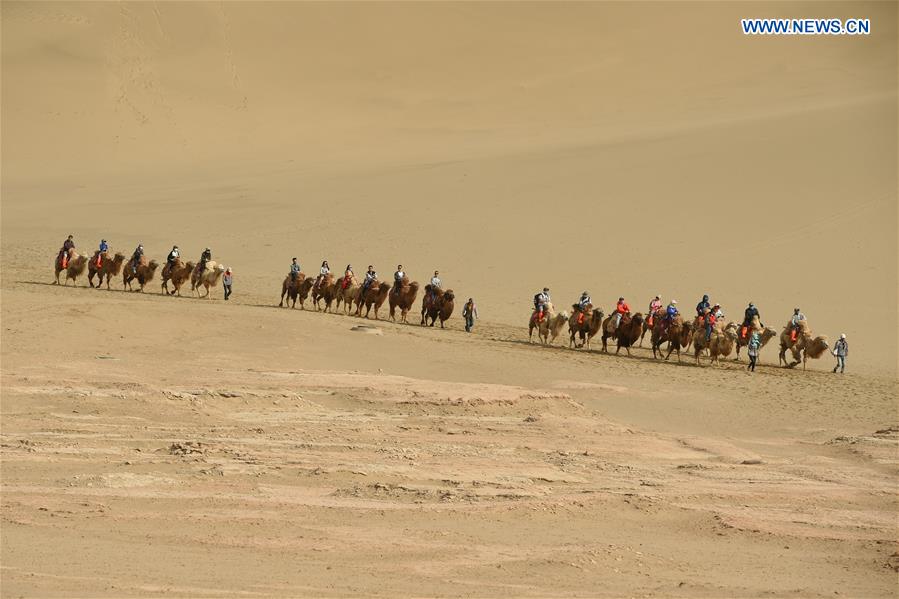 Mingsha Sand Mountain scenery zone in Dunhuang attracts tourists