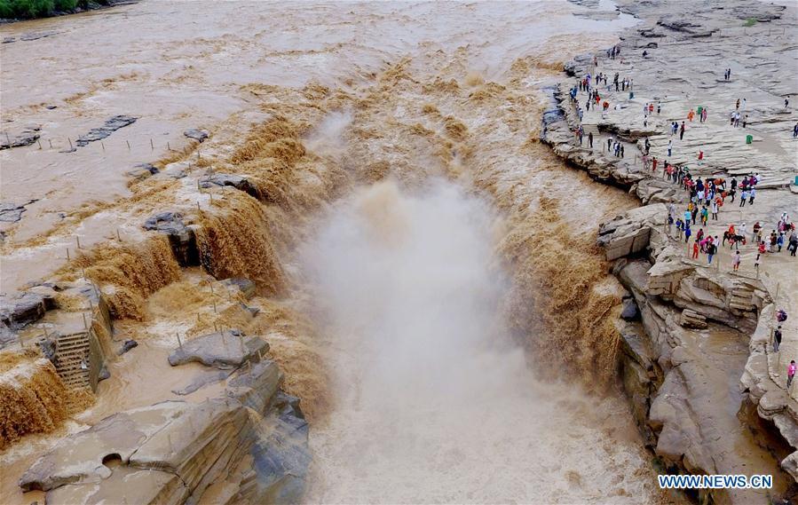 Water volume of Hukou Waterfall surges due to heavy rainfall