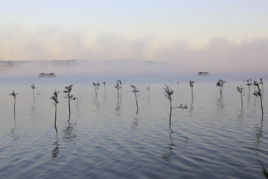 Fog-enveloped Tianquan Lake in Jiangsu