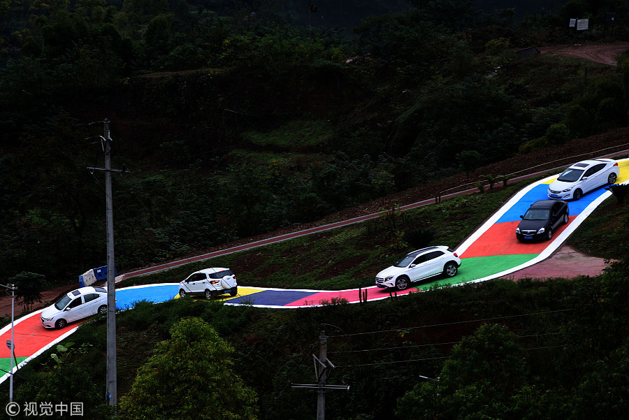 Snakelike colorful road draws tourists