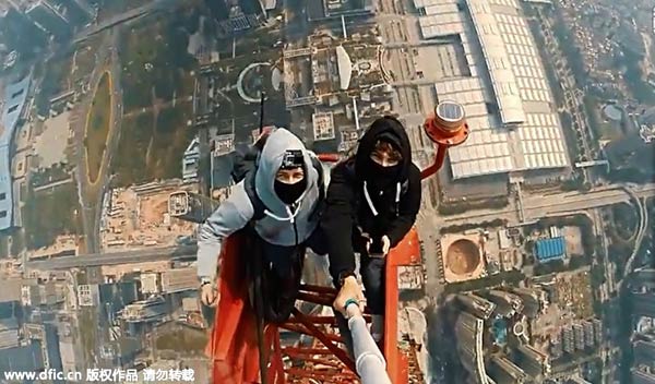 Russian daredevils scale Ping An building