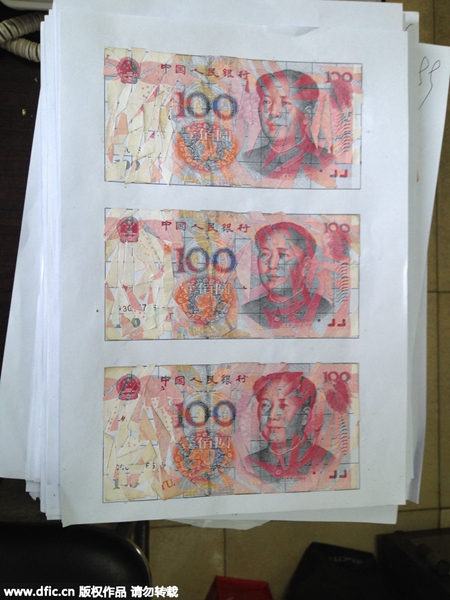 Son puts together banknotes after dad hacks $21,000 into pieces