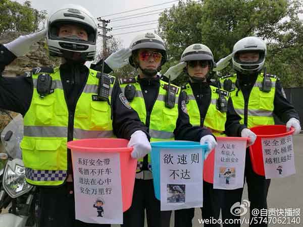 Police officers show off 'bucket waists' to promote traffic safety