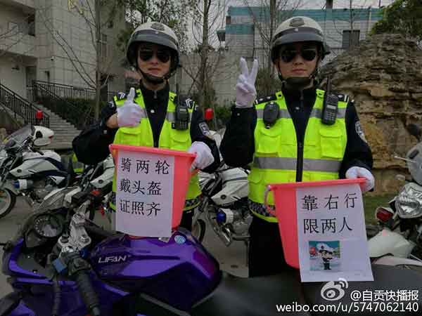 Police officers show off 'bucket waists' to promote traffic safety