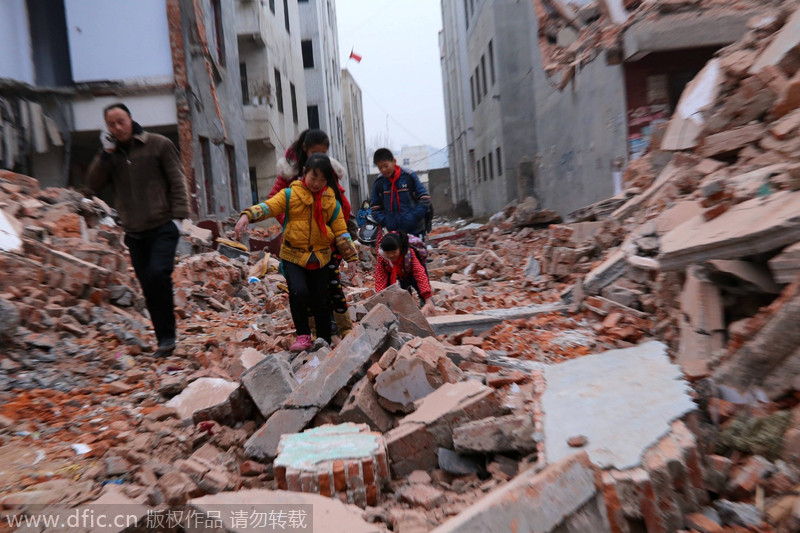 Building ruins block the way to school 