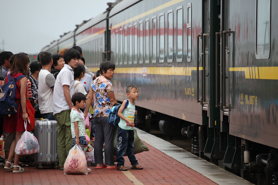 Goodbyes and tears as left-behind children head home