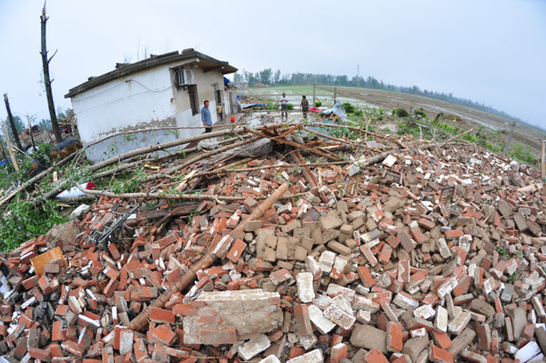 Storms, tornado leave 98 dead