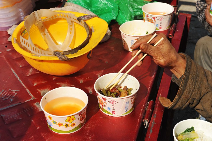 Cooking lunch for Chinese construction workers