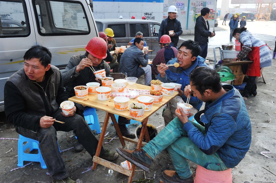 Cooking lunch for Chinese construction workers