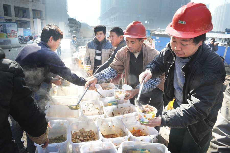 Cooking lunch for Chinese construction workers