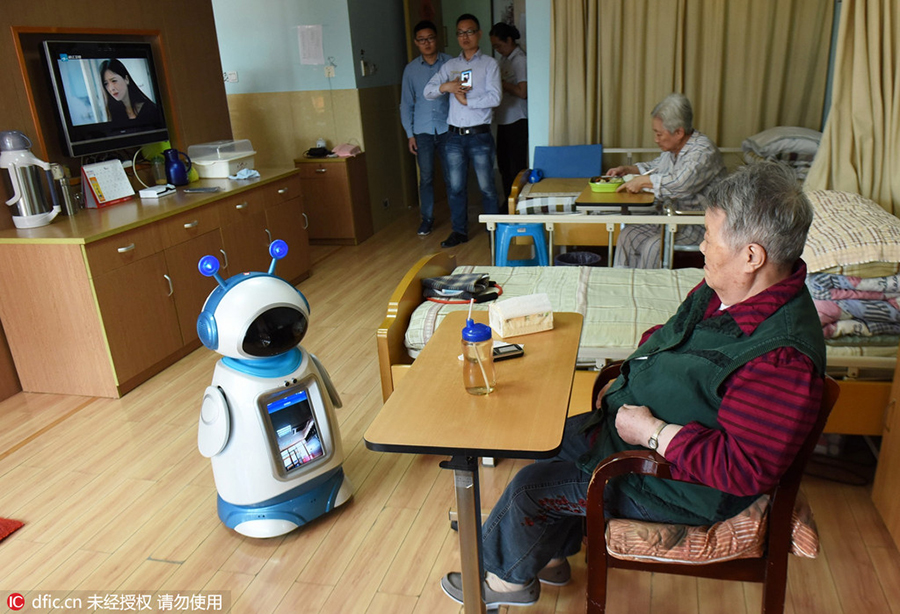 Robots help elderly in nursing home in east China