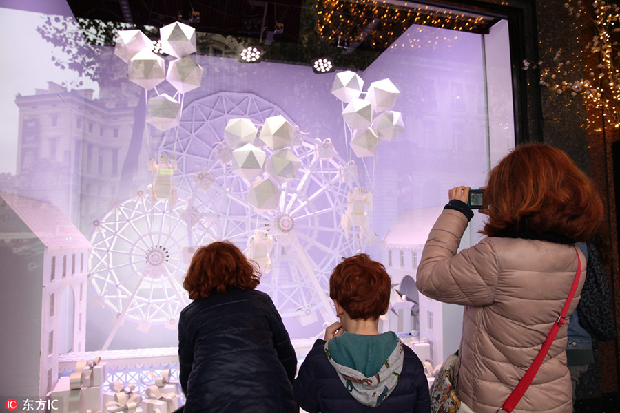 Stores decorate windows for upcoming Christmas shopping season