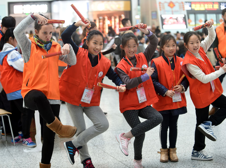 Offering holiday cheer during train station travel rush