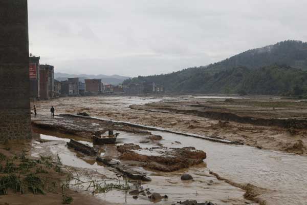 13 missing after flooding in SW China