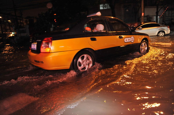 Beijing drenched in downpour