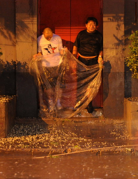 Beijing drenched in downpour