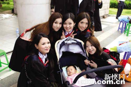 Graduating student juggles baby and books