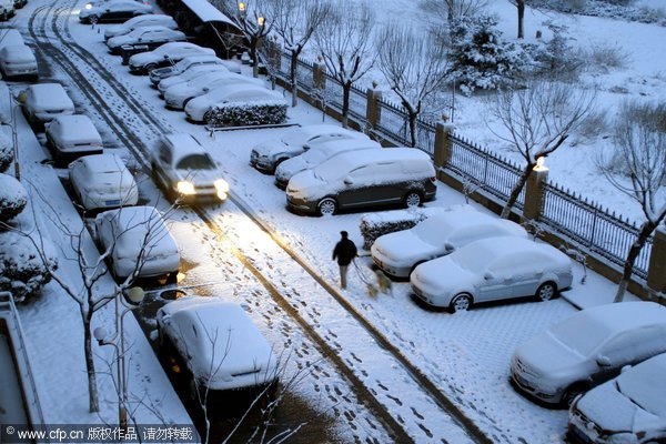 Beijing blanketed by spring snow