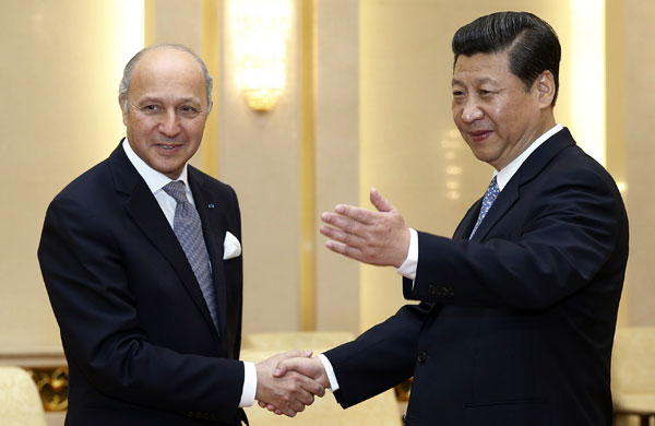 Xi urges close relations with France