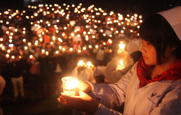 Candlelight prayers for quake victims