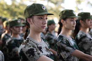 Military training with bottles balanced on heads