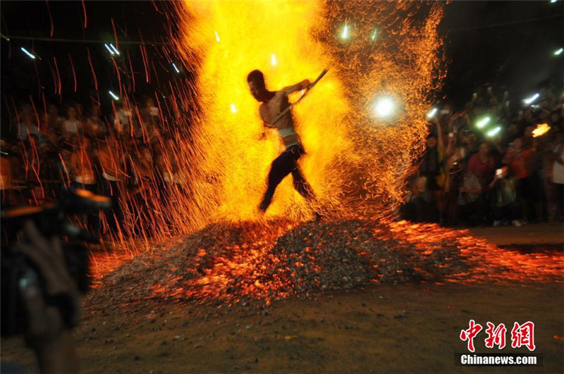 Folk activity 'walking on fire' staged in E China