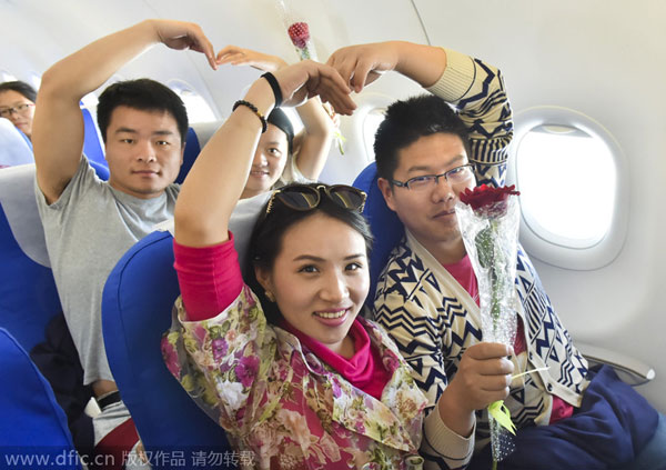 58 couples say 'I do' among the clouds