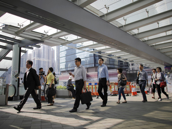 HK officials resume work as protests thin