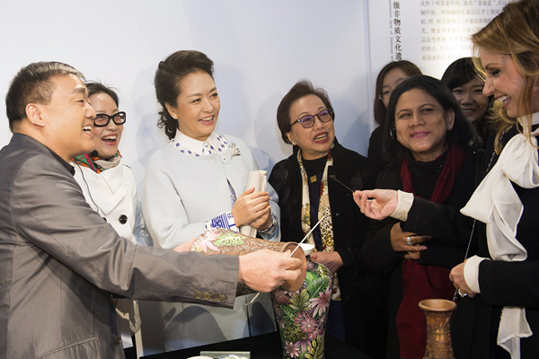 Wives work to boost cultural exchanges among economies