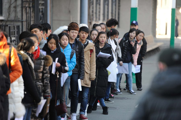 Smiles, worries, spears at college entrance exam