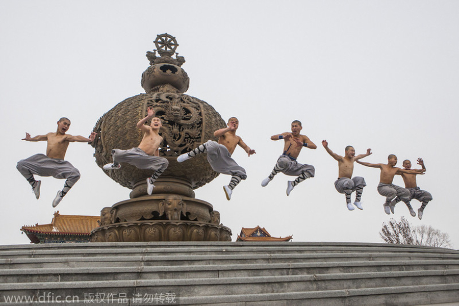 Buddhist monks break bricks in kung fu