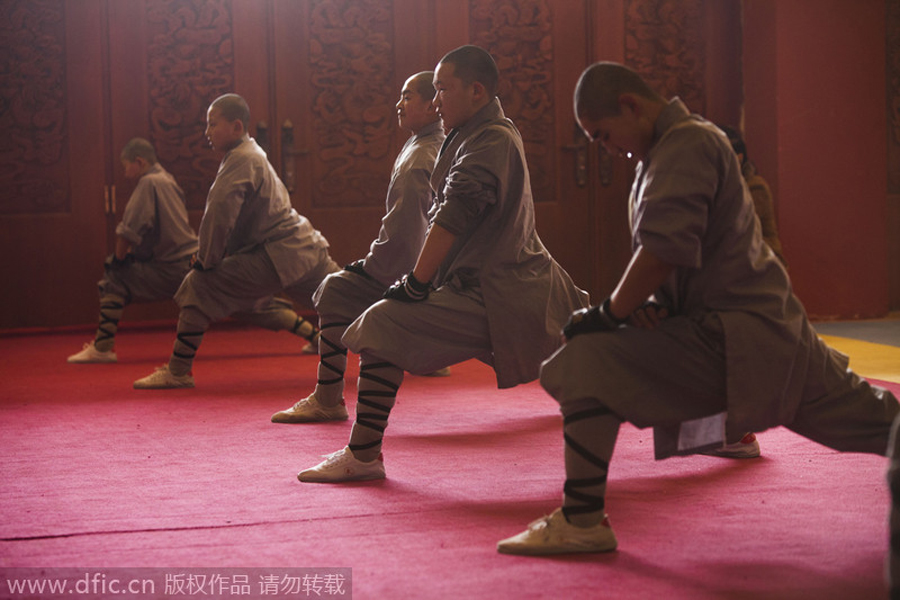 Buddhist monks break bricks in kung fu