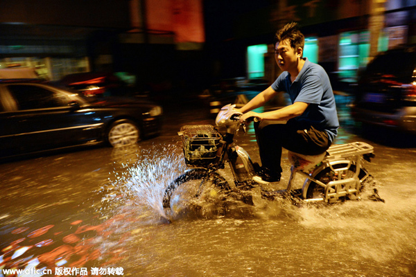 Rains leave Beijing's streets flooded, force evacuation