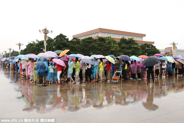 Rains leave Beijing's streets flooded, force evacuation